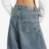 Kirli vintage mavi renkli, kadınlar için düşük kasıklu bol kesim kot pantolon Kirli vintage mavi renkli, kadınlar için düşük kasıklu bol kesim kot pantolon